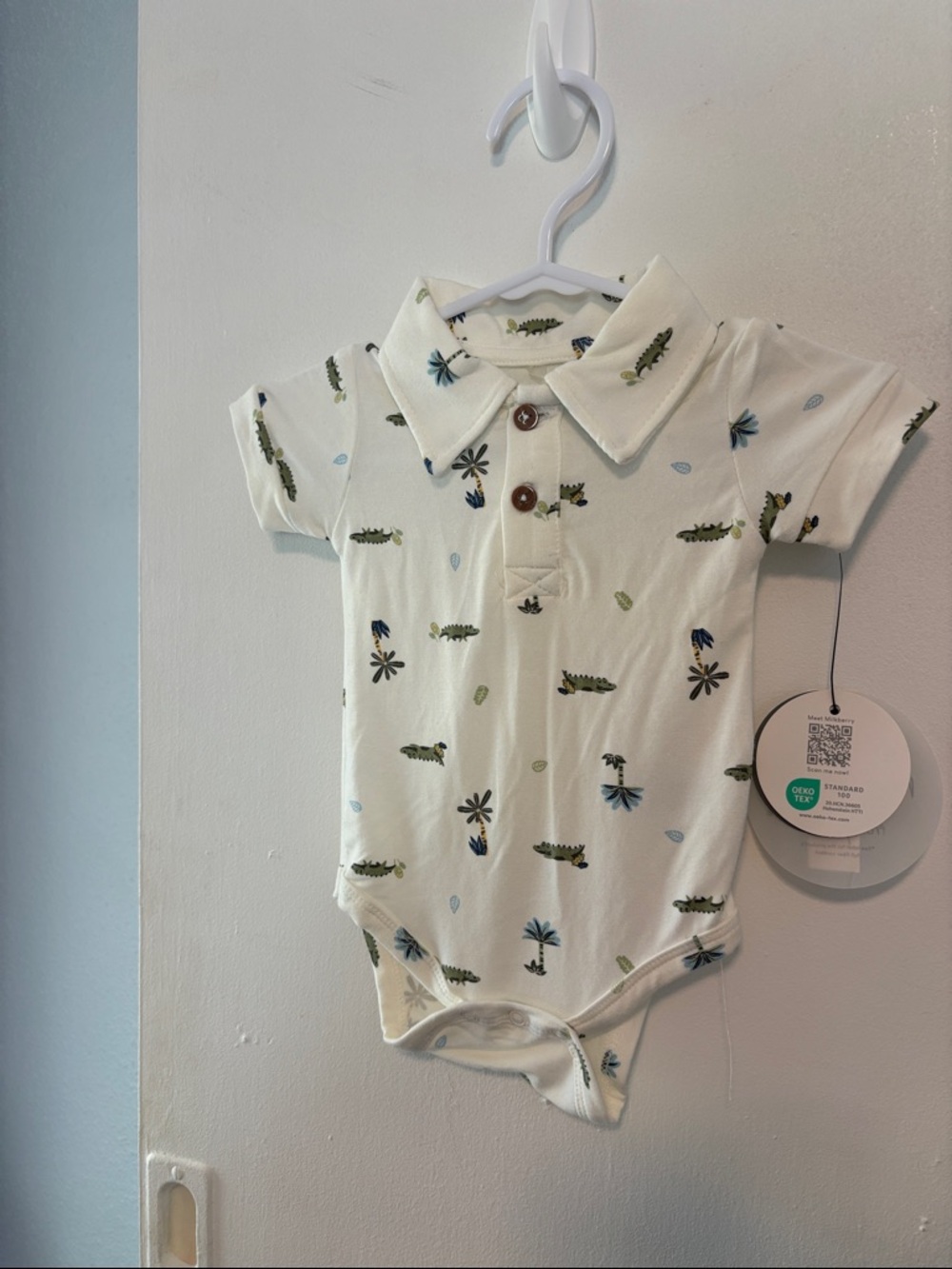 Cream Baby Polo Onesie with tropical print
